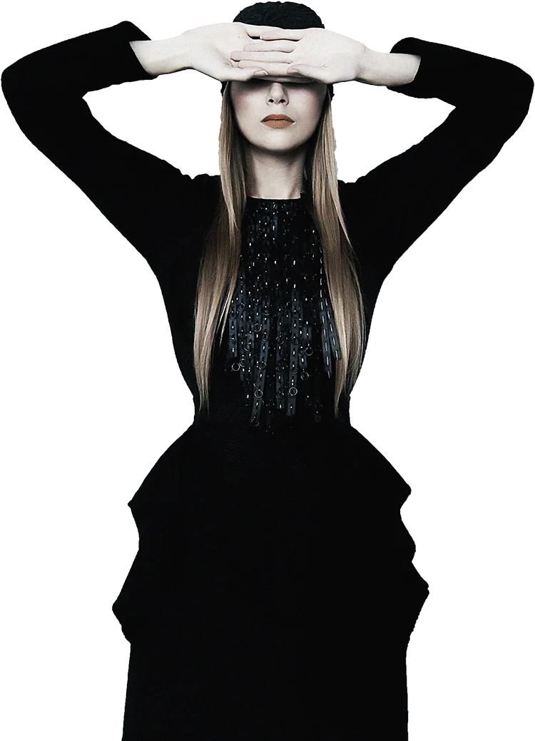 Woman in a black dress with long hair against a white background.