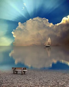 A lone sailboat on a calm, reflective lake with dramatic clouds and sun rays.